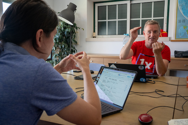 Christoph Breidert speaks to Jamie Abrahams during a workshop